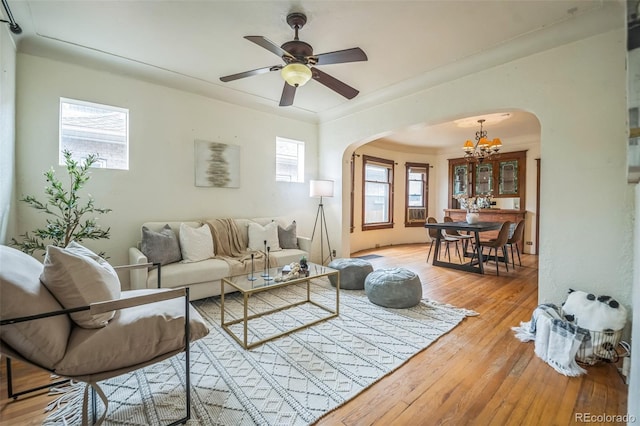 3024 W Denver Pl, Denver, CO 80211 - living area with arched walkways, a chandelier, wood-type flooring, and a ceiling fan