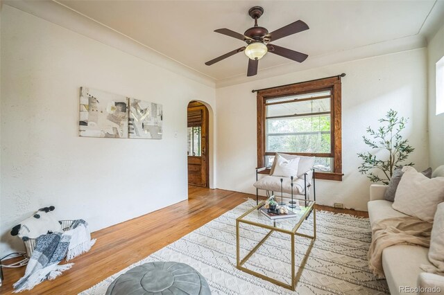 3024 W Denver Pl, Denver, CO 80211 - living area with arched walkways, wood finished floors, and a ceiling fan