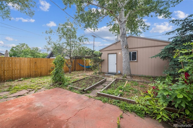 3024 W Denver Pl, Denver, CO 80211 - view of yard featuring a vegetable garden and a patio