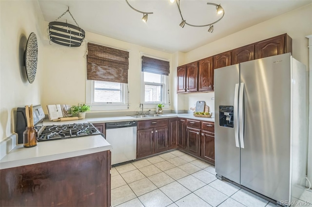 3024 W Denver Pl, Denver, CO 80211 - kitchen with appliances with stainless steel finishes, a sink, light tile patterned flooring, and light countertops