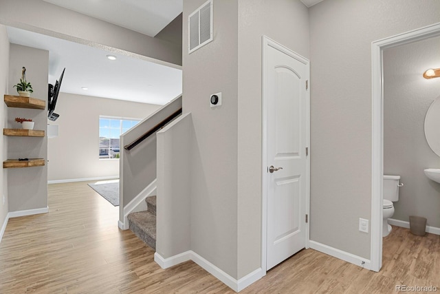 5166 Trails Edge Ln, Castle Rock, CO 80104 - hall with light wood finished floors, stairs, and baseboards