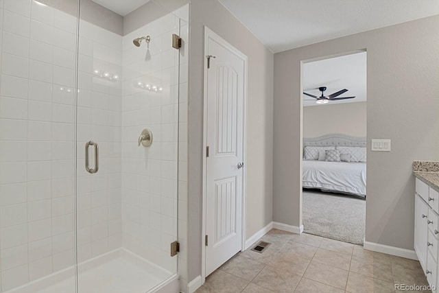 5166 Trails Edge Ln, Castle Rock, CO 80104 - ensuite bathroom featuring a stall shower, baseboards, a ceiling fan, and vanity