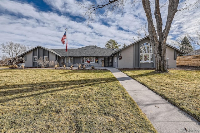 single story home featuring a front yard