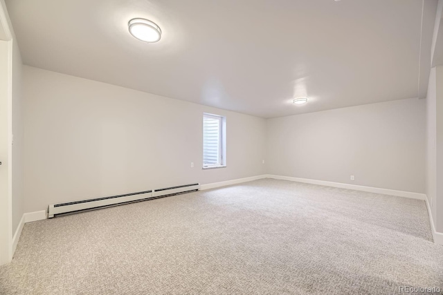 carpeted spare room with baseboard heating