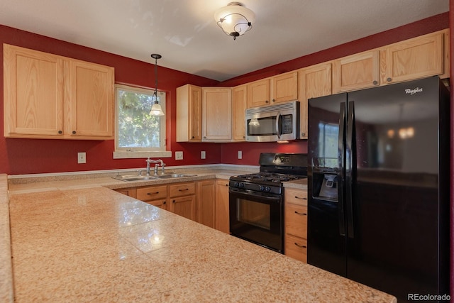 kitchen with sink, black appliances, decorative light fixtures, and light brown cabinets