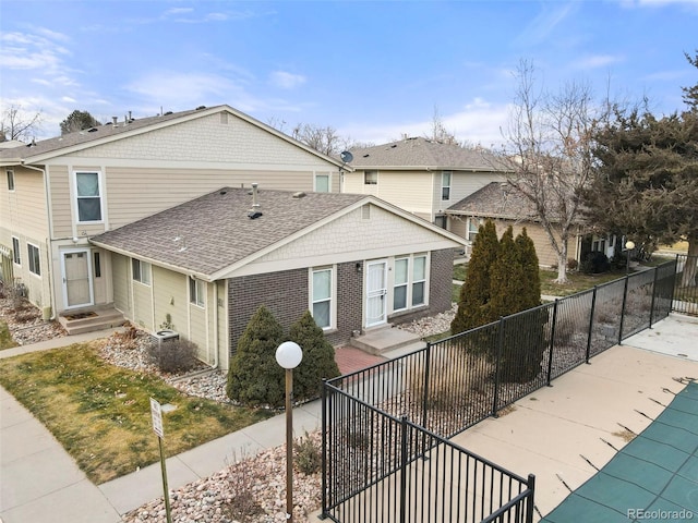 front of property with a covered pool