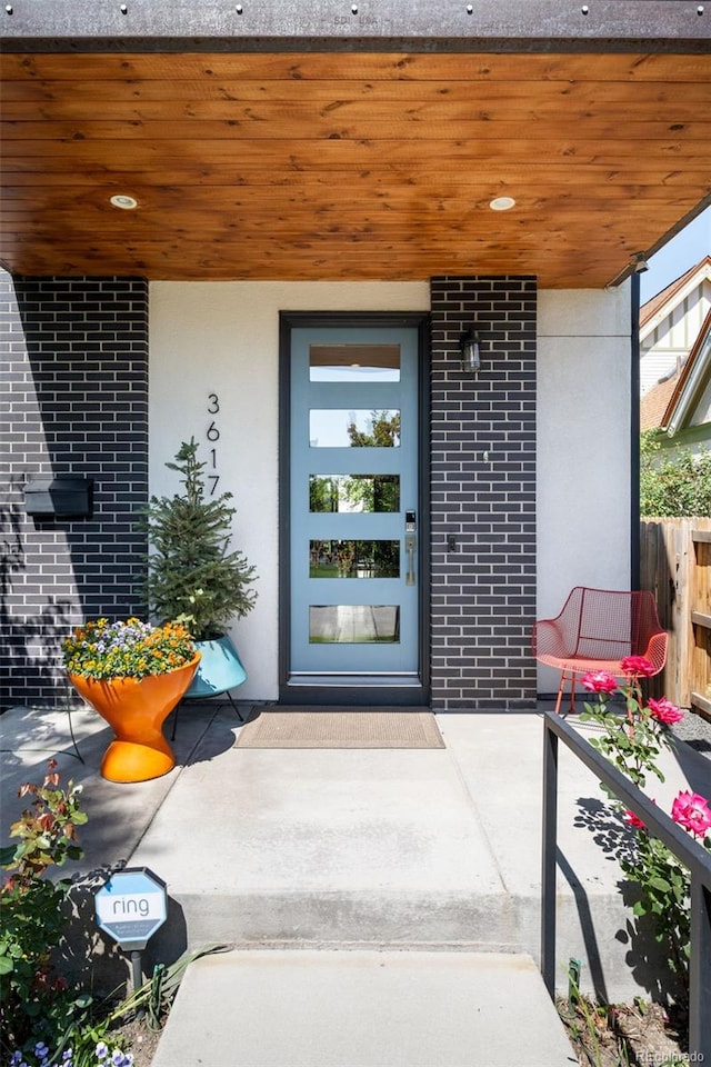 3617 Shoshone St, Denver, CO 80211 - doorway to property with brick siding