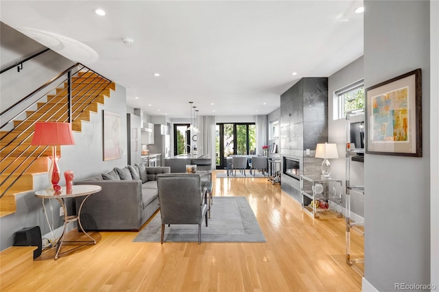 3617 Shoshone St, Denver, CO 80211 - living room with stairs, light wood finished floors, recessed lighting, and a fireplace