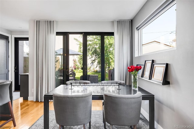 3617 Shoshone St, Denver, CO 80211 - dining room featuring wood finished floors and french doors