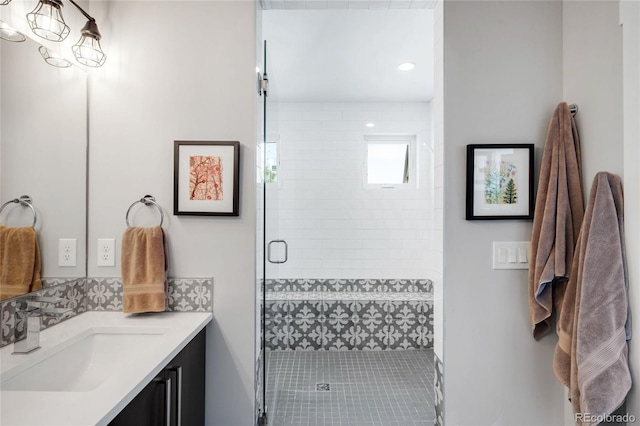 3617 Shoshone St, Denver, CO 80211 - bathroom with vanity, a shower stall, and recessed lighting