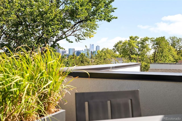 3617 Shoshone St, Denver, CO 80211 - exterior view of stucco siding and city skyline