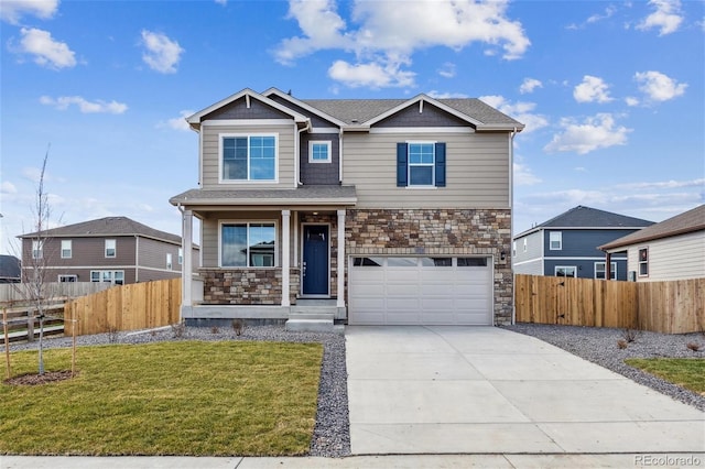 view of front of home with a garage and a front lawn