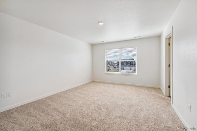 empty room with light colored carpet