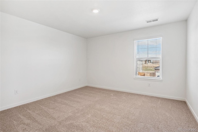 unfurnished room featuring carpet