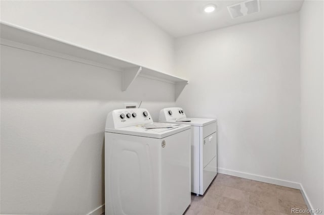 washroom with separate washer and dryer