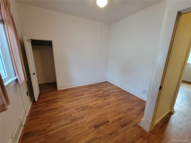 unfurnished room with light hardwood / wood-style floors and ceiling fan