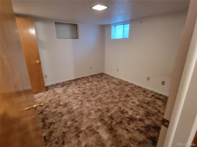 basement featuring carpet flooring