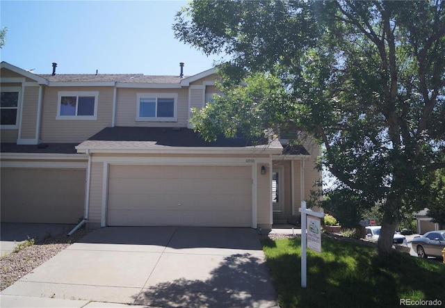 10966 Josephine St, Northglenn, CO 80233 - view of front of house featuring a garage and concrete driveway