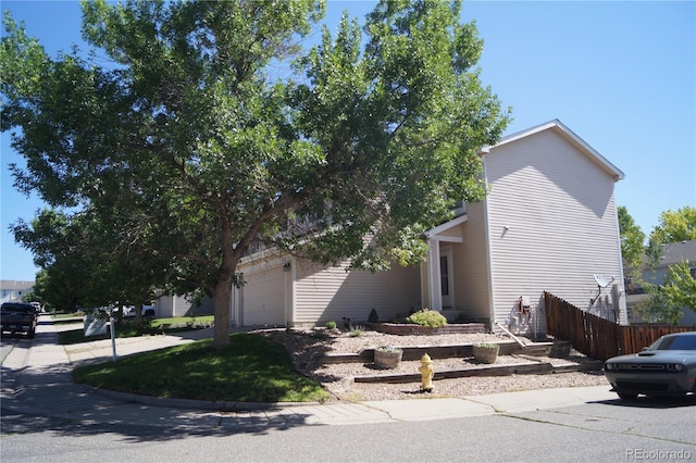 10966 Josephine St, Northglenn, CO 80233 - obstructed view of property with an attached garage