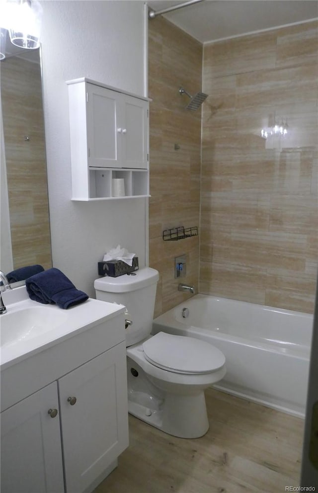 10966 Josephine St, Northglenn, CO 80233 - full bathroom with bathtub / shower combination, vanity, and wood finished floors