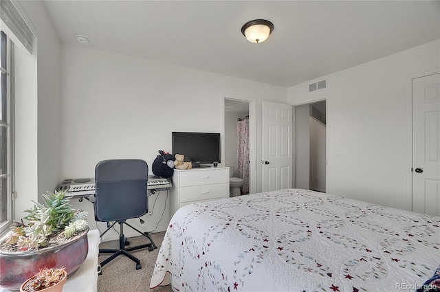 carpeted bedroom featuring connected bathroom