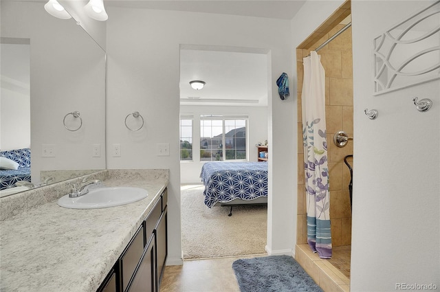 bathroom with vanity, curtained shower, and tile patterned floors