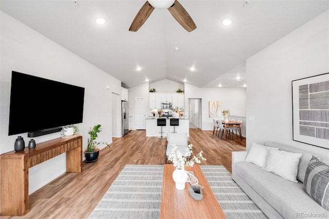 2080 Autumn Moon Dr Unit 5, Windsor, CO 80550 - living area with vaulted ceiling, ceiling fan, light wood-style flooring, and recessed lighting