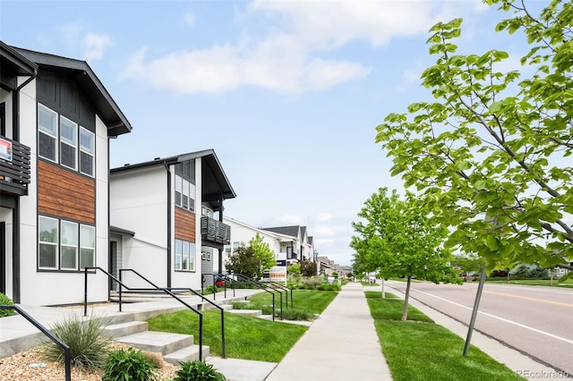 2080 Autumn Moon Dr Unit 5, Windsor, CO 80550 - view of asphalt road featuring sidewalks and a residential view