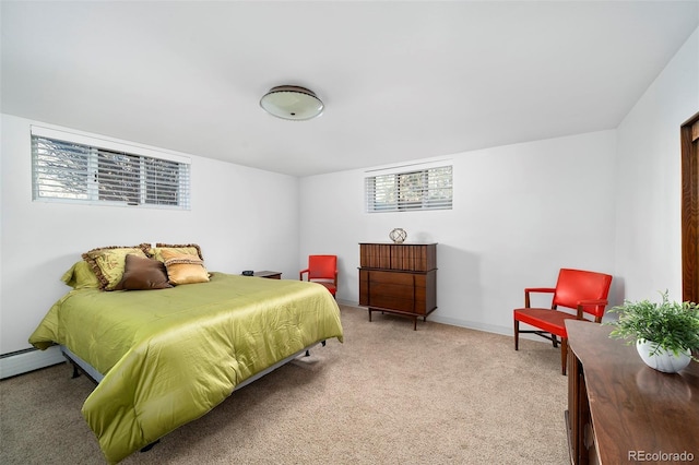 bedroom featuring a baseboard radiator, light colored carpet, and baseboards