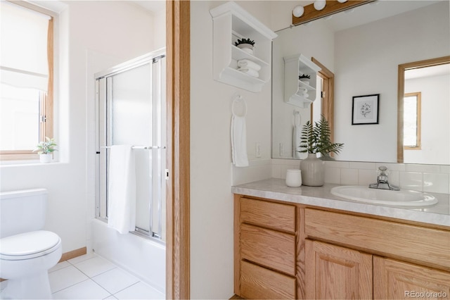 1131 N 4th St, Johnstown, CO 80534 - bathroom featuring vanity, tile patterned floors, enclosed tub / shower combo, and healthy amount of natural light