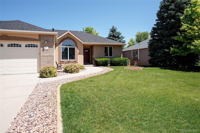 1131 N 4th St, Johnstown, CO 80534 - ranch-style home featuring brick siding, a front lawn, concrete driveway, an attached garage, and a shingled roof