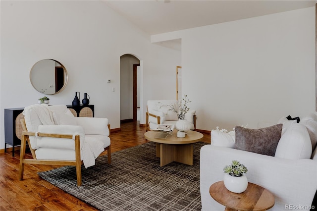 1131 N 4th St, Johnstown, CO 80534 - living area with arched walkways and wood finished floors