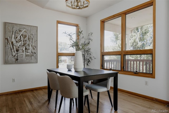 1131 N 4th St, Johnstown, CO 80534 - dining room with light wood-type flooring and a chandelier