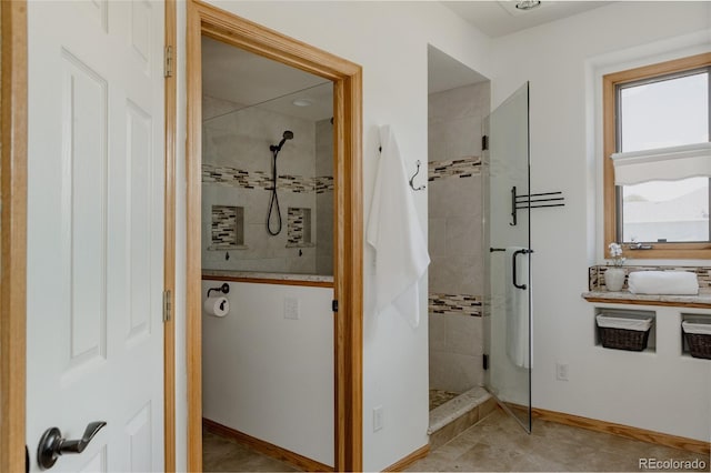 1131 N 4th St, Johnstown, CO 80534 - bathroom with a shower stall and baseboards