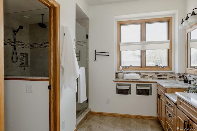 1131 N 4th St, Johnstown, CO 80534 - full bathroom featuring a shower stall, vanity, and backsplash