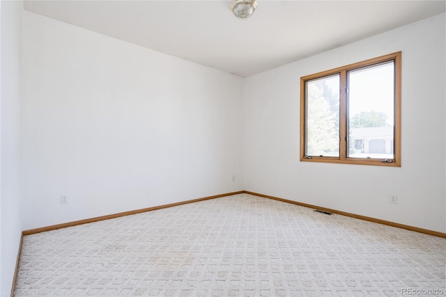1131 N 4th St, Johnstown, CO 80534 - spare room featuring baseboards and carpet floors