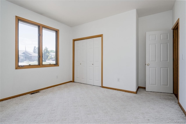 1131 N 4th St, Johnstown, CO 80534 - unfurnished bedroom with light colored carpet and a closet