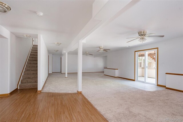 1131 N 4th St, Johnstown, CO 80534 - unfurnished living room with stairway, ceiling fan, carpet, and wood finished floors