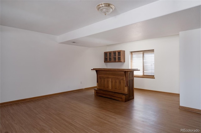 1131 N 4th St, Johnstown, CO 80534 - unfurnished living room with wood finished floors and baseboards