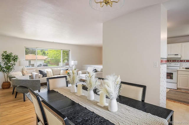 1270 Berea Dr, Boulder, CO 80305 - dining space with a chandelier and light wood-style flooring