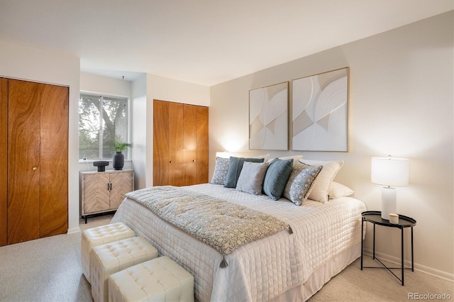 1270 Berea Dr, Boulder, CO 80305 - bedroom featuring light colored carpet, baseboards, and two closets