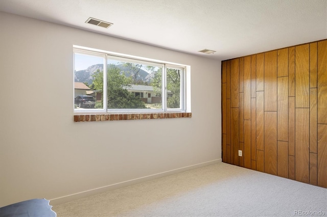 1270 Berea Dr, Boulder, CO 80305 - unfurnished bedroom with carpet, baseboards, and wooden walls
