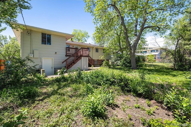 1270 Berea Dr, Boulder, CO 80305 - back of property featuring stairway, fence, and a deck