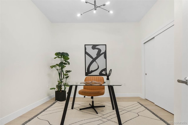2530 Lawrence St Unit Ra101, Denver, CO 80205 - office area with light wood-type flooring, a chandelier, and baseboards
