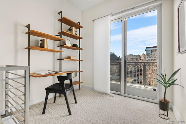 2530 Lawrence St Unit Ra101, Denver, CO 80205 - office area featuring a city view, visible vents, baseboards, and carpet floors