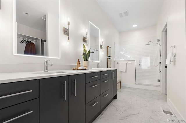 2530 Lawrence St Unit Ra101, Denver, CO 80205 - bathroom featuring double vanity, a stall shower, baseboards, and marble finish floors