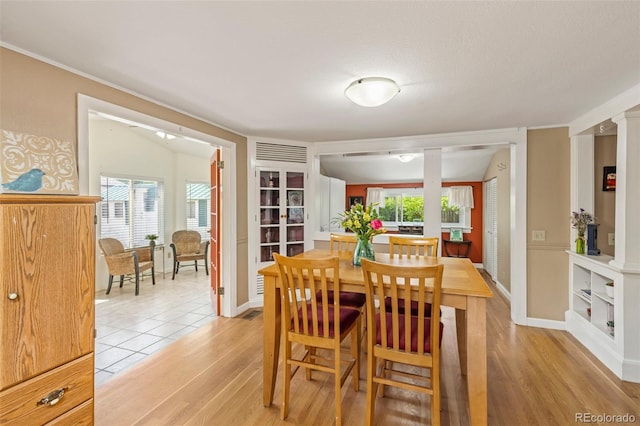 6480 W 60th Ave, Arvada, CO 80003 - dining room with light wood finished floors, plenty of natural light, and baseboards
