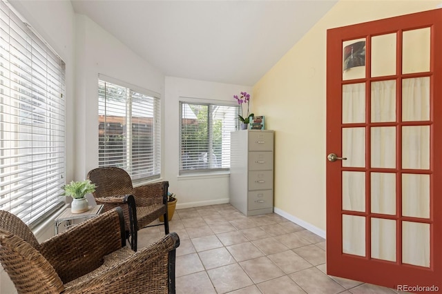6480 W 60th Ave, Arvada, CO 80003 - living area with vaulted ceiling, baseboards, and light tile patterned floors