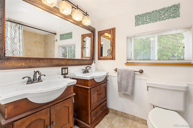 6480 W 60th Ave, Arvada, CO 80003 - bathroom featuring two vanities, tile patterned flooring, toilet, and curtained shower