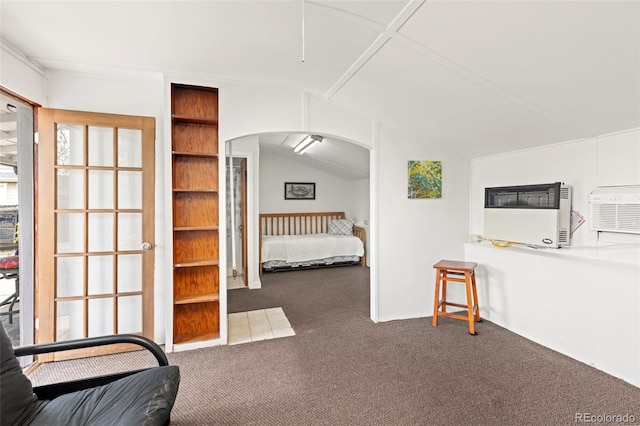 6480 W 60th Ave, Arvada, CO 80003 - carpeted bedroom with arched walkways, heating unit, vaulted ceiling, and a wall mounted AC